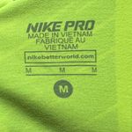 Nike  Pro lime green and black cropped leggings medium Photo 5