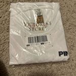 PINK - Victoria's Secret Vs pink small t shirt hot pink round graphics in the back Photo 4