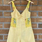 Likely  yellow floral jumpsuit size 10 Photo 9