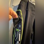 Under Armour Women’s  leggings - size XL - black w/neon green stitching - pockets Photo 7