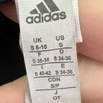 Adidas , athletic mini shorts, women’s size small, logo graphic Photo 2