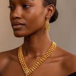 Gold Tone beaded V Photo 0