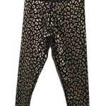 AQUA  black and gold animal print 7/8 leggings. Photo 1