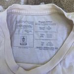 Patagonia  women’s yellow lightweight logo mountain T-shirt size small Photo 3