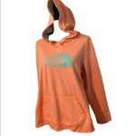 The North Face  neon orange with teal writing size XL hooded sweatshirt. Photo 1