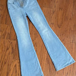 Wonderly  Urban Cowboy Light Wash High Rise Boot Cut Jeans With Tie Closure. gently warn& are in excellent condition. measurements approximately 13” waste x 10” rise x 42” long. Non smoking home. priced to sell at as is condition. Don’t like my price, make reasonable offer! And thank you for checking my closet. Photo 0