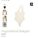 We Wore What  Women's Asymmetrical Thong Bodysuit Ivory Size L Photo 1