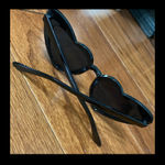 Black Heart Eyes Sunnies Black Sunglasses. gently warn and excellent condition. None smoking home. Priced to sell at as is condition or make reasonable offers. Photo 3