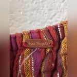 Free People Vibrant Striped Jumpsuit
Pit to Pit is 14” to 18” Photo 1