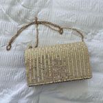 Sequin sparkly clutch with a detachable long chain and a sparkly gold finish Photo 0