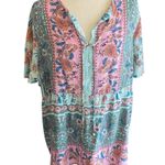 Boutique NWOT--WOMENS SIZE 2X-PINK AND GREEN BABYDOLL TOP Gorgeous pink and green babydoll top, has stretch tie at neck, short sleeves, 100% polyester, excellent condition  Measurements: Bust: armpit to armpit 23 inches  Length: shoulder seam to bottom 27 inches  Photo 0