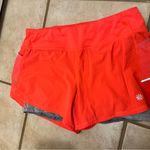 Athleta Women's bright orange/coral gray Athletic Shorts Photo 0