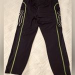 Under Armour Women’s  leggings - size XL - black w/neon green stitching - pockets Photo 2