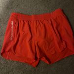 Athleta Orange Altheta Girl Shorts Photo 0