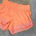 Athleta Mesh Racer Run Mid Rise 4” Shorts Pull On Running in Orange Size XXS Photo 3