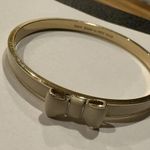 Kate Spade  Signed Bangle Bracelet Bow Tie Creamy White / Gold Tone - 7 3/4 Inch Photo 7