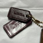 Coach  Brown Clutch with Monogram Pattern and Zipper Closure Photo 2