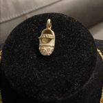 Gold and White Baby Shoe Pendant Necklace Photo 0