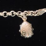 Sterling silver and peridot lucky charm bracelet. Photo 5