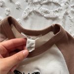 Full Tilt XS WHITE CROP TOP WITH PINK BUTTERFLY PATCH AND BROWN SLEEVES Photo 1