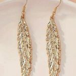 Gorgeous 14K Gold Plated Feather Shaped Dangle Earrings Photo 0