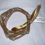 Tell Your Tale Guitar String Gold Tone With Faux Pearl Bracelet Set Photo 1
