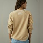 American Eagle  Funday Graphic Happiest Here Smiley Tan Sweatshirt - size XL Photo 11