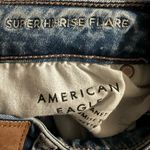 American Eagle AE Next Level Ripped Super High Waisted Flare Jean 2 Regular Blue Photo 4