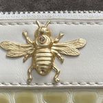Bumble Bee clutch with wrist band. Color cream. Faux reptile design. Zip top Photo 4