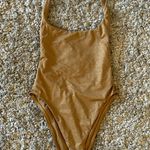Vitamin A  Gold One Piece Photo 0