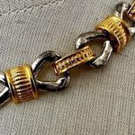 silver and gold tone bow necklace Photo 1