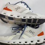 on cloud On Running Women's Athletic Shoes in White, Orange, and Blue Photo 9