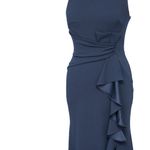 Betsy and Adam . Christine Scuba Crepe Ruffled Bow Gown. Photo 10