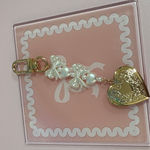 Gold Heart and Pearl Bow Keychain Photo 0