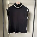 WKND Nation Fleece Turtleneck Tank in Black with Cream Lining Photo 0