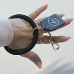 Boulevard Keychain wristlet, black and gold tone carabin closure Photo 0