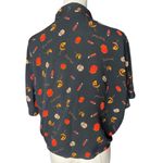 Trick R Treat Sam
Crop Shirt Spirit Halloween NWOT
Black Button Photo 4
