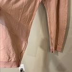 Free People movement dusty rose colored joggers with ankle zip and drawstring Photo 5