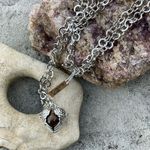 Boutique Tigers Eye stone in a heart shaped necklace cage. 36”chain Photo 5