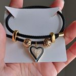 Adjustable steel wire bracelet with charm. Gold Photo 3
