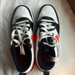 Nike dunks black white and orange Photo 0