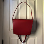 London Fog red faux leather. Adjustable strap and handles. GUC Photo 2