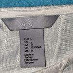 H&M raglan puffy long sleeves key hole with pearl button textured blouse size L Photo 5