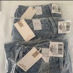 Good American 90s Duster high rise straight leg jeans ripped in blue950 2/26 Photo 6