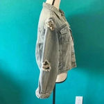Unif  frayed distressed light wash jean jacket in size xs Photo 4
