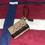 Coach  Signature brown Patent Leather Wristlet coin purse J0849-41637 
4x6” Photo 1