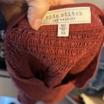 Side Stitch Burnt Orange Raw Hem Button Photo 3