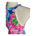 Lilly Pulitzer Gorgeous bright color floral dress, white crochet circles bodice, dress is fully lined, has pockets, hidden back zipper, excellent condition Measurements: Bust: armpit to armpit 16 inches Waist: side to side 14 inches Length: shoulder seam to bottom Photo 5