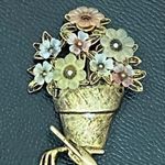 LIA Signed Pot of Flowers with Garden Tools Gold Photo 1