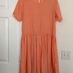 Sign Here Signature Clothing drop waist dress in pastel peach. Photo 0